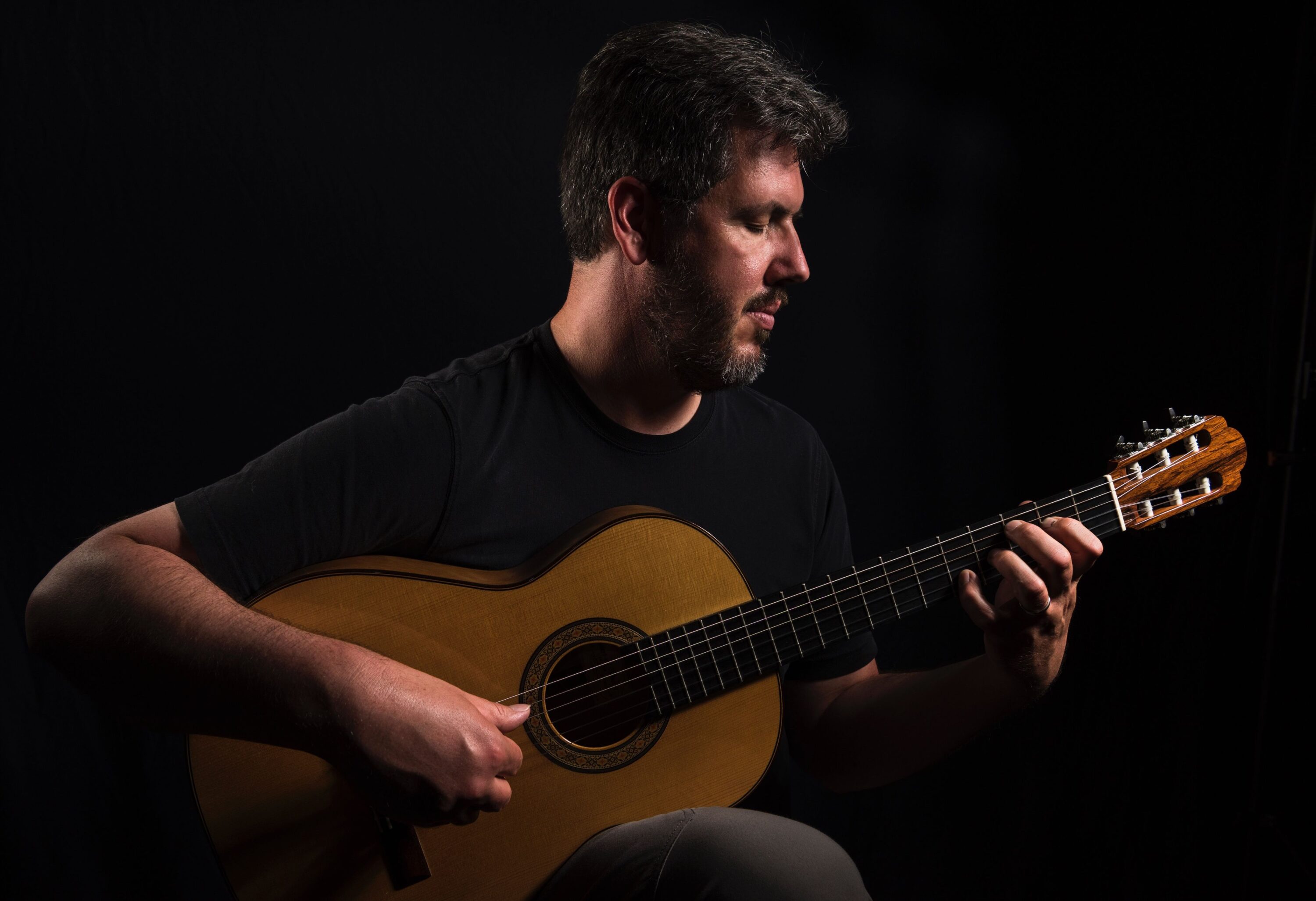 Gen Ian Young musician with guitar
