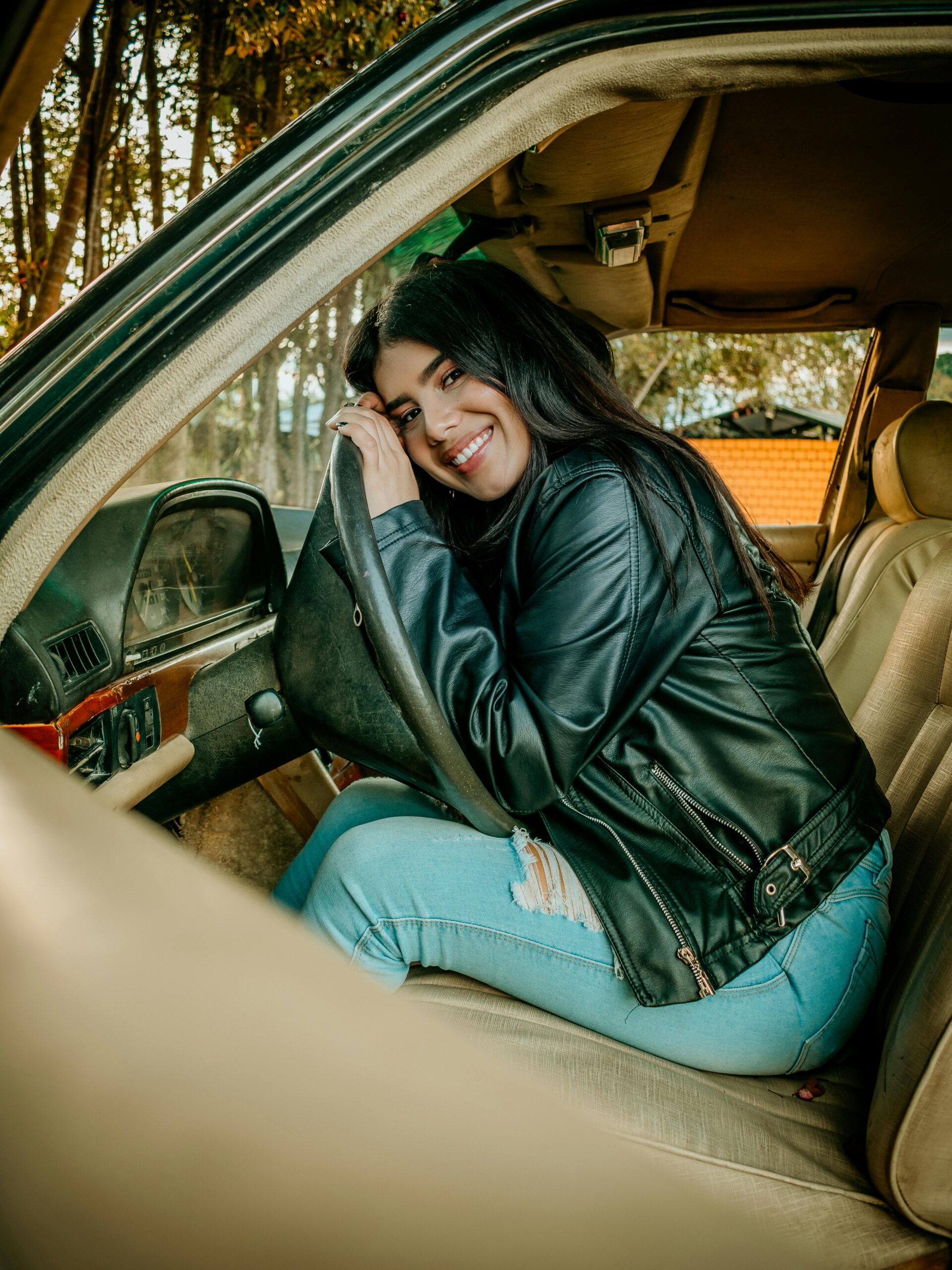 happy woman sitting the car